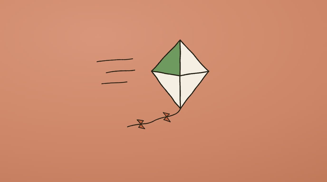 Illustration of a paper kite with a bowed tail lifting on the wind